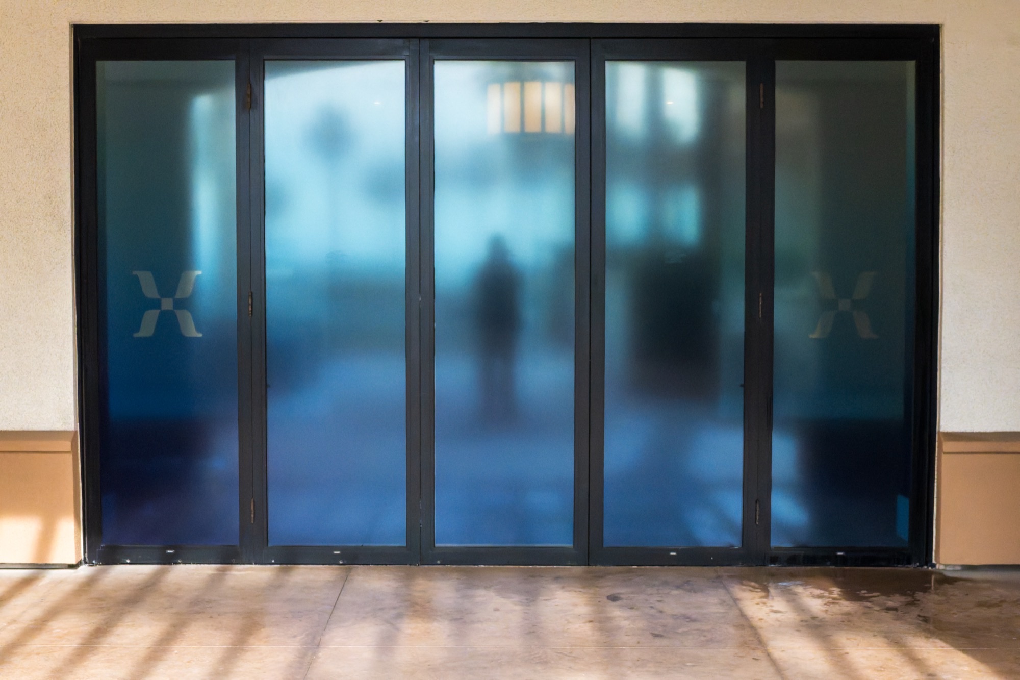 Translucent window film creating stained glass effect with Mixpanel branding