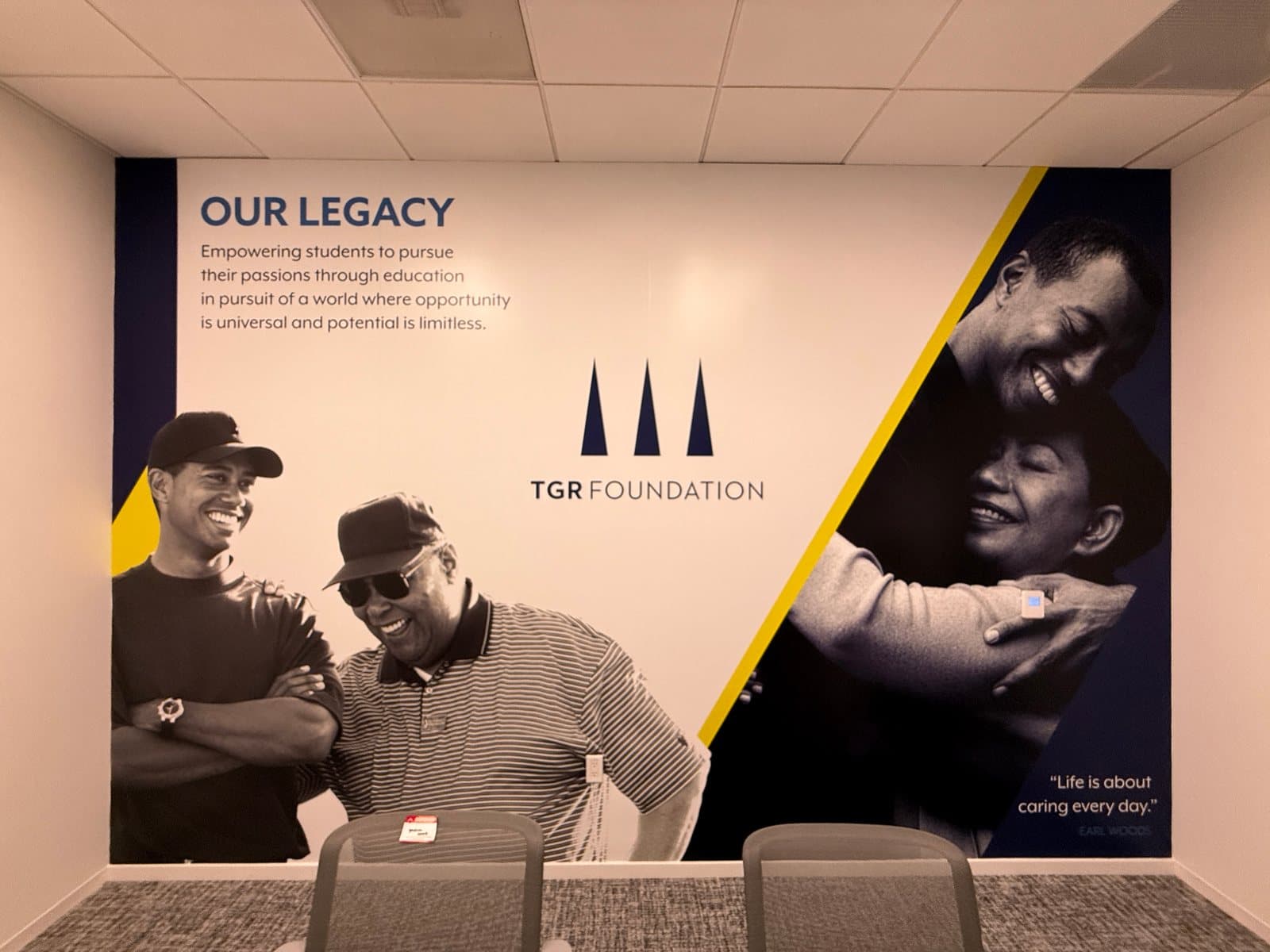 Our Legacy wall graphic with black and white photos beside the TGR Foundation logo