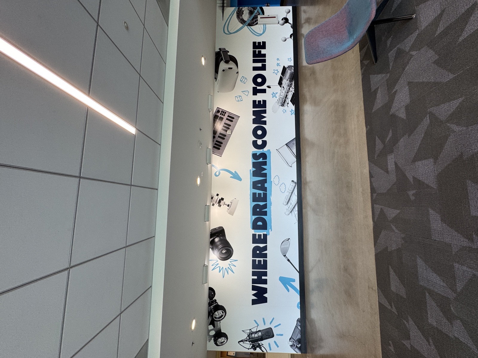 Where Dreams Come to Life wall banner with illustrated STEM objects