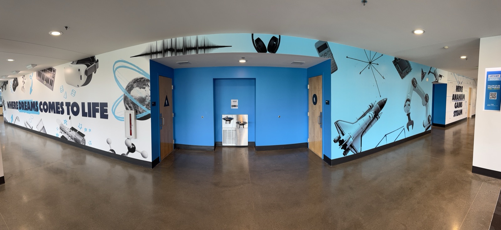 Panoramic wall mural with Where Dreams Comes to Life and STEM imagery