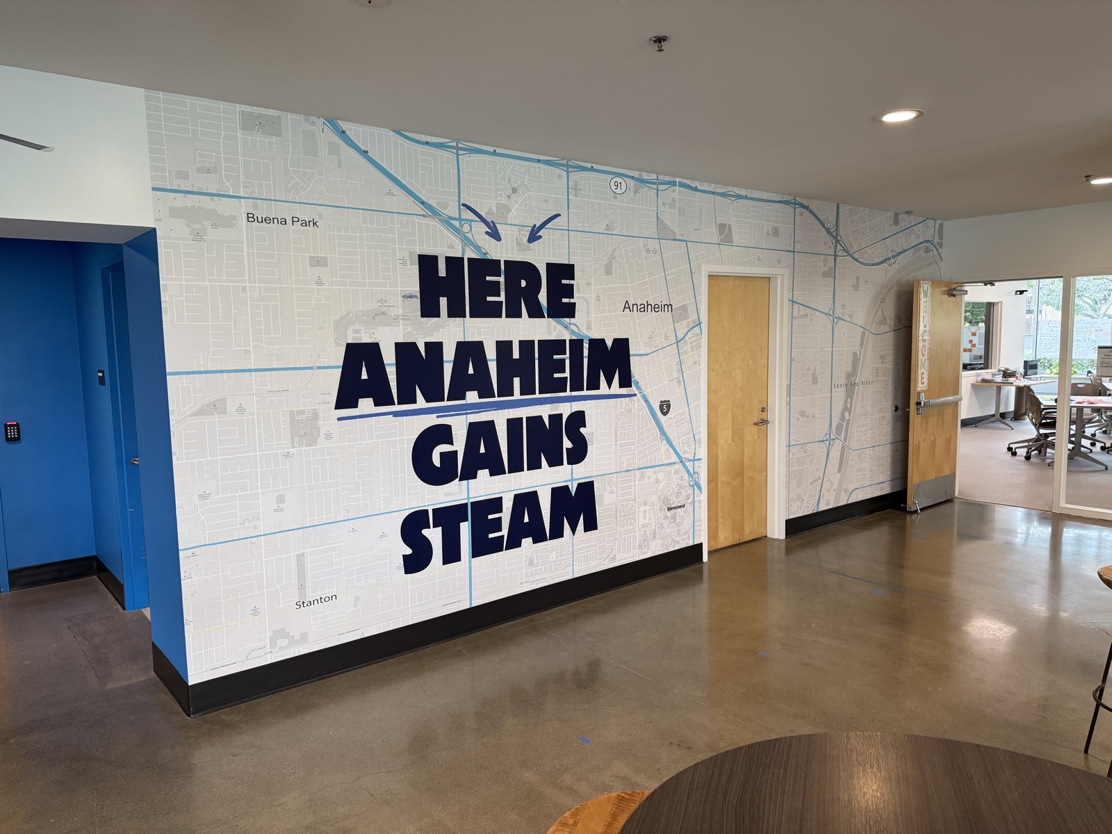 Hallway mural with STEM imagery including rockets and satellites