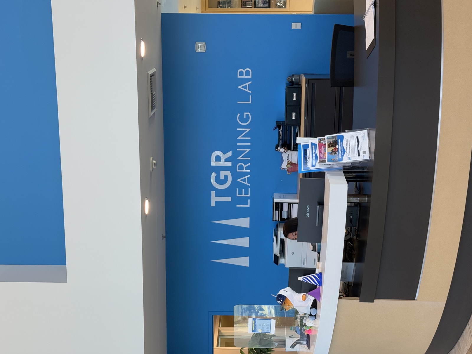 TGR Learning Lab logo on blue branded wall in main lobby