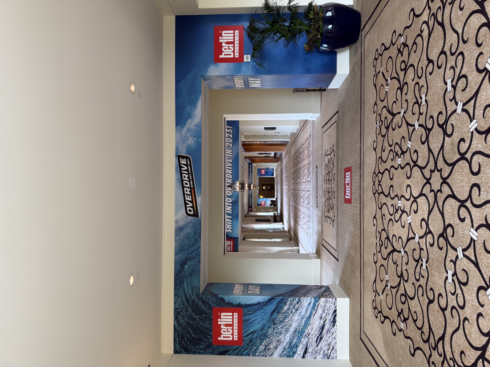 Hotel hallway transformed with branded event graphics for a conference