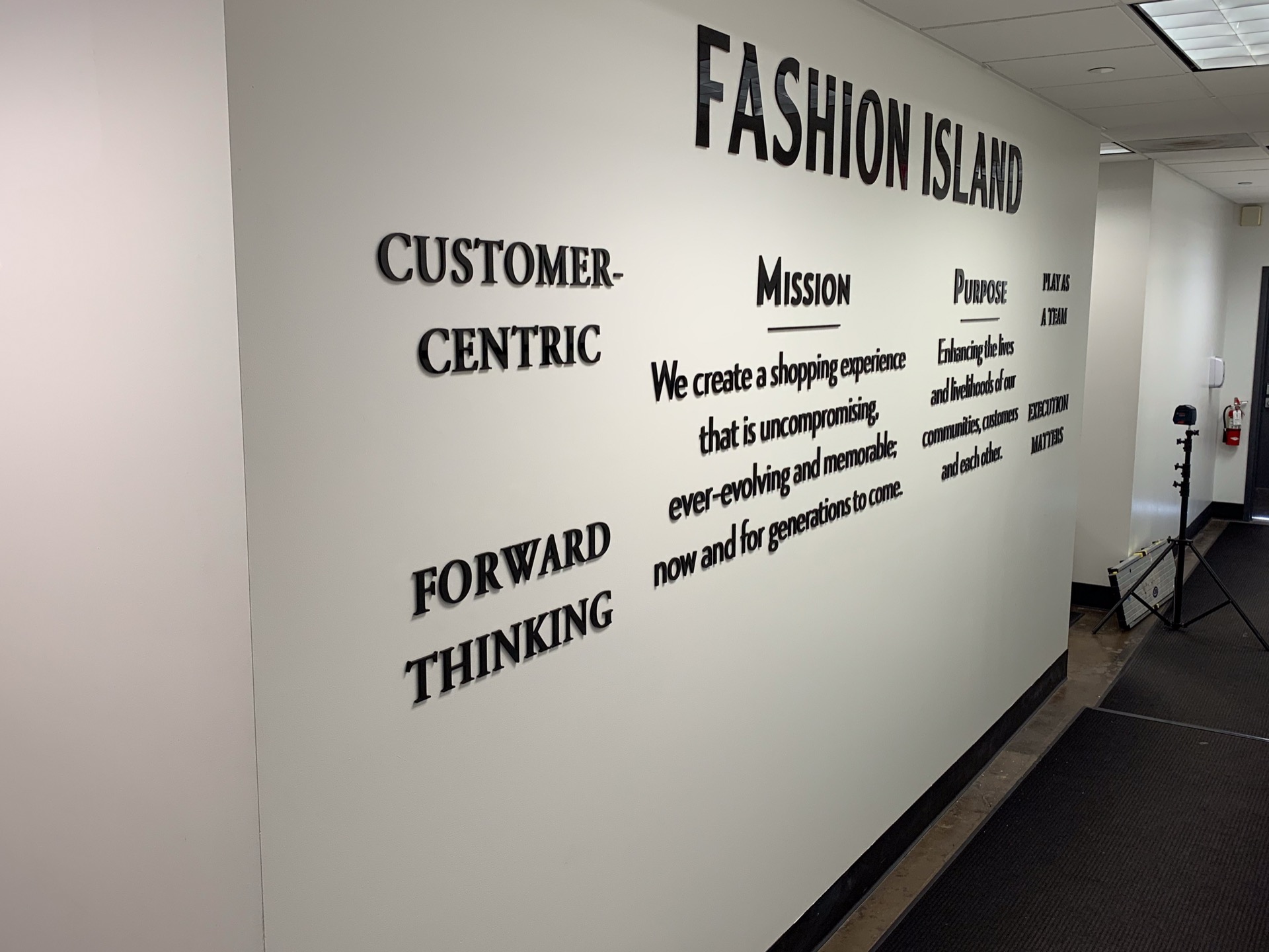 Fashion Island corporate office with mission and values displayed in dimensional wall lettering